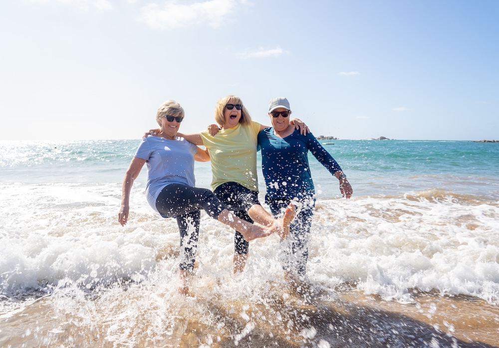 Senior citizen friends on a beach