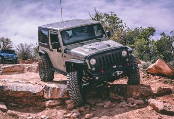 Jeep atop rocks