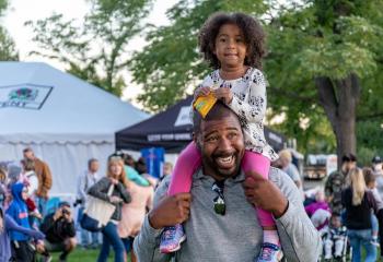 Father and daughter enjoying festival