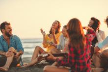 Friends laughing on beach