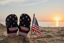 American flag sandals on the beach
